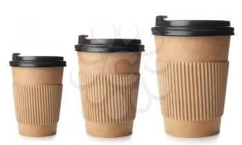 Different sized takeaway coffee cups on white background�