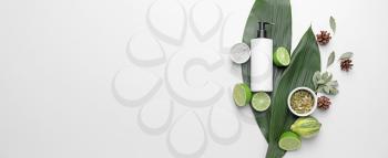 Shampoo with natural extract and ingredients on white background with space for text�