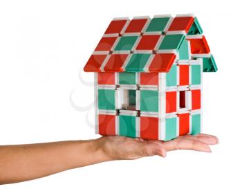 The house in human hands.Model of the house in hands isolated on white background