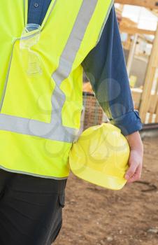 A young worker at the construction site with safety equipment