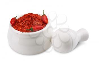 Crushed Chillies in the white ceramic mortar isolated