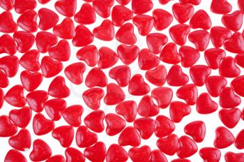 red hearts shaped candy as background