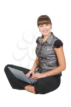 Beautiful businesswoman with laptop isolated over white background
