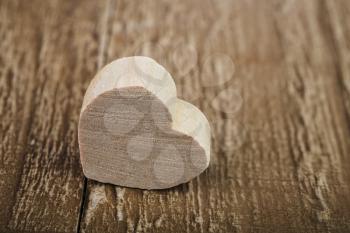 wooden heart valentines day symbol on wooden background
