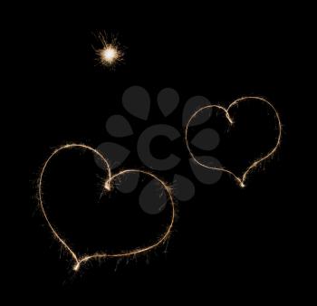 two hearts from sparkler  on black background