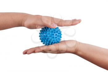 Woman's hands with Spiny plastic blue massage ball isolated on white background