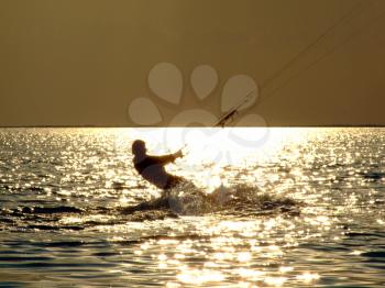 Royalty Free Photo of a Kitesurfer at Sunset