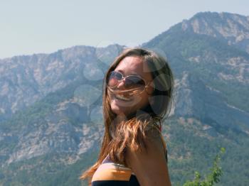 Royalty Free Photo of a Girl at the Mountains