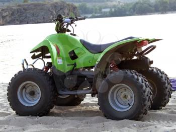 Royalty Free Photo of an ATV Beside a River