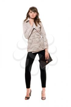 Royalty Free Photo of a Woman in a Jacket Holding a Purse