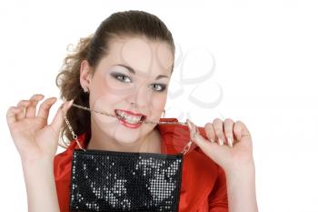 Royalty Free Photo of a Girl Holding a Handbag in Her Teeth