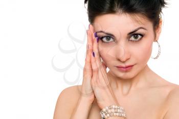 Royalty Free Photo of a Young Woman With Her Hands at Her Face