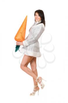 Royalty Free Photo of a Woman Holding a Large Carrot