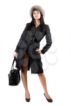 Royalty Free Photo of a Woman in a Coat and Hat