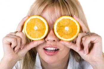 Royalty Free Photo of a Woman With Orange Slices Over Her Eyes