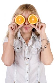 Royalty Free Photo of a Woman Covering Her Eyes With Orange Slices