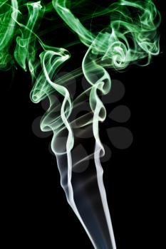 Royalty Free Photo of Green Smoke on a Black Background
