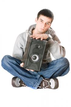 Royalty Free Photo of a Boy Holding a Speaker