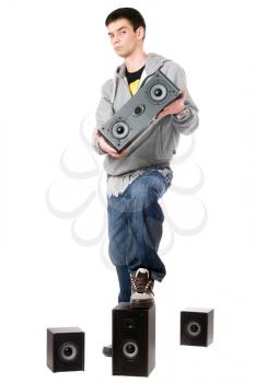 Royalty Free Photo of a Boy With Four Speakers