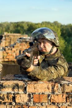 Royalty Free Photo of a Soldier With a Machine Gun