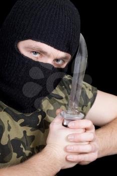 Royalty Free Photo of a Man Wearing a Balaclava Holding a Knife