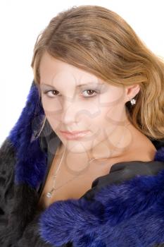 Royalty Free Photo of a Young Woman in a Fur Coat