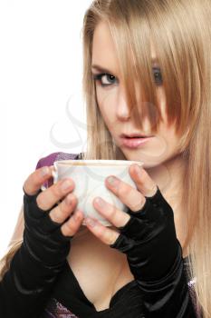 Royalty Free Photo of a Girl Drinking From a Teacup