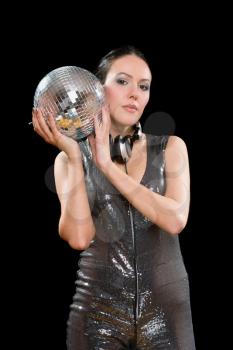 Portrait of nice young brunette with a mirror ball in her hands. Isolated on black