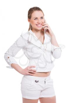 Portrait of joyful young woman talking on the phone. Isolated on white