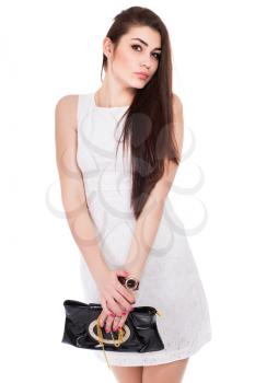 Portrait of sexy brunette posing in white dress. Isolated on white