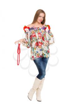 Playful young woman posing in flowery blouse. Isolated on white