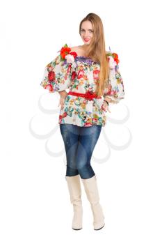 Smiling young woman posing in flowery blouse. Isolated on white