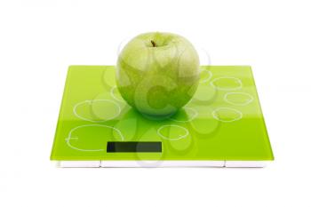 Green apple with water drops on scales. Isolated