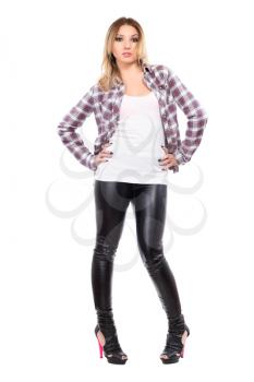 Young woman wearing checked shirt and black pants. Isolated on white