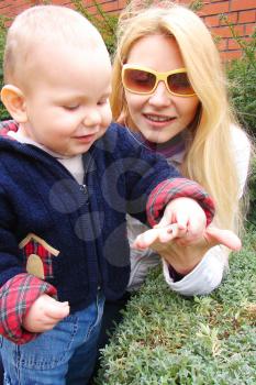 Royalty Free Photo of a Mother and Son in the Garden