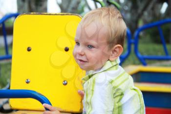 Royalty Free Photo of a Little Boy Playing at a Park