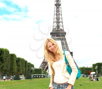 Vacation in Paris. Lucky girl near the Eiffel Tower