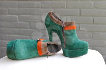 Ladies the green suede shoes on a heel and platform
