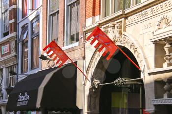 DORDRECHT, THE NETHERLANDS - SEPTEMBER 28: Flags and signs on the building on September 28, 2013 in Dordrecht, Netherlands