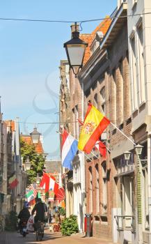 DORDRECHT, THE NETHERLANDS - SEPTEMBER 28: National flags on celebratory street on September 28, 2013 in Dordrecht, Netherlands