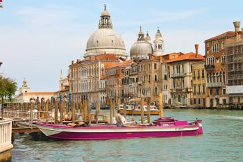 VENICE, ITALY - MAY 06, 2014: View of the Grand Canal and the Church Santa Maria della Salute in Venice, Italy
