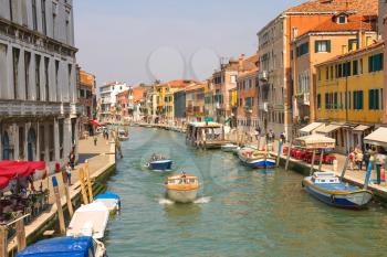 VENICE, ITALY - MAY 06, 2014: Active movement on a canal in sunny spring day,Venice, Italy