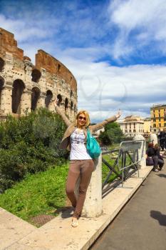 ROME, ITALY - MAY 04, 2014: Girl on excursions at the Colosseum. Rome, Italy
