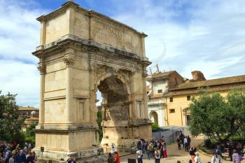 ROME, ITALY - MAY 04, 2014: Tourists in square near the Triumphal Arch of Titus in Rome, Italy