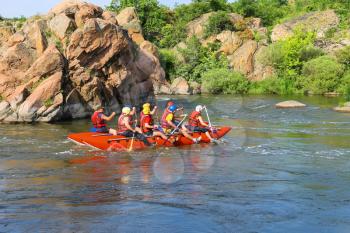 NIKOLAEV, VILLAGE GRUSHEVKA, UKRAINE - MAY 23, 2014: Rafting tourists with an experienced instructor on the river Southern Bug