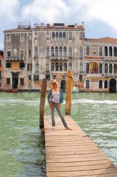 Attractive girl  on a bridge in Venice, Italy 