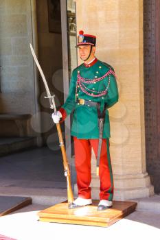 SAN MARINO. SAN MARINO REPUBLIC - AUGUST 08, 2014: Guardsman in colorful uniforms on a post near the Palazzo Pubblicco  in San Marino. The Republic of San Marino
