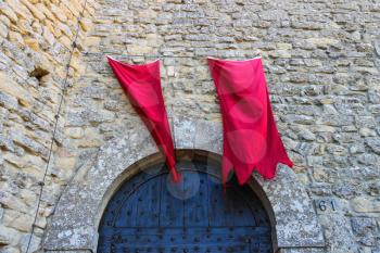 Red flags over the gates fortresses in San Marino. The Republic of San Marino