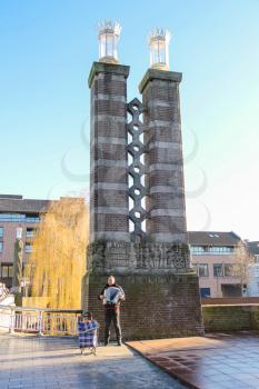 Den Bosch, Netherlands - January 17, 2015: Street musician plays the accordion in park of the Dutch city Den Bosch