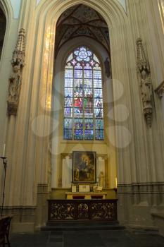 Den Bosch, Netherlands - January 17, 2015: Stained glass and  picture in the cathedral  the Dutch city of Den Bosch